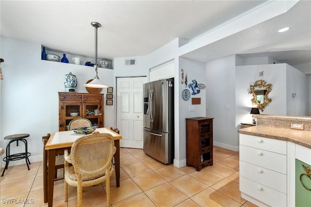 10921 Santa Margherita Rd Unit 104, Estero, FL 34135 - dining room with light tile patterned floors