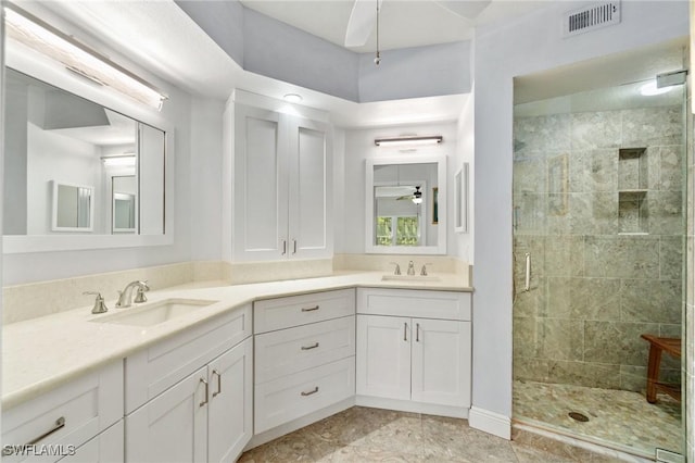 10921 Santa Margherita Rd Unit 104, Estero, FL 34135 - full bath with ceiling fan, a stall shower, and double vanity