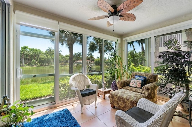 10921 Santa Margherita Rd Unit 104, Estero, FL 34135 - sunroom / solarium with tile patterned flooring, a ceiling fan, and a water view