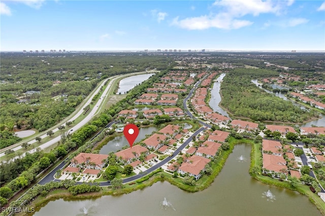 10921 Santa Margherita Rd Unit 104, Estero, FL 34135 - aerial view of property and surrounding area with nearby suburban area and a large body of water