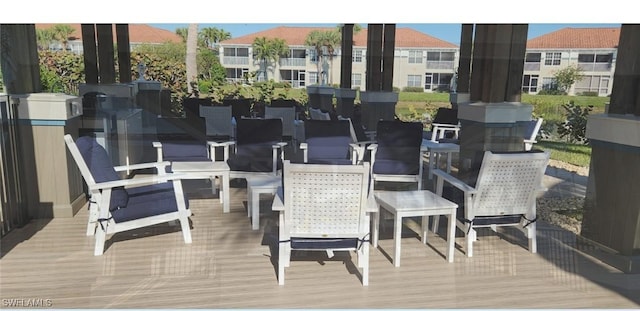 10921 Santa Margherita Rd Unit 104, Estero, FL 34135 - deck with outdoor dining area