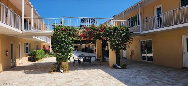 548 Broad Ave S Unit 548, Naples, FL 34102 - view of property's community with outdoor dining space and a patio area