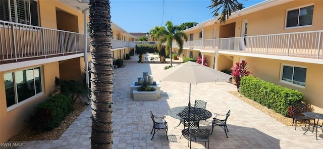 548 Broad Ave S Unit 548, Naples, FL 34102 - view of patio / terrace featuring outdoor dining space