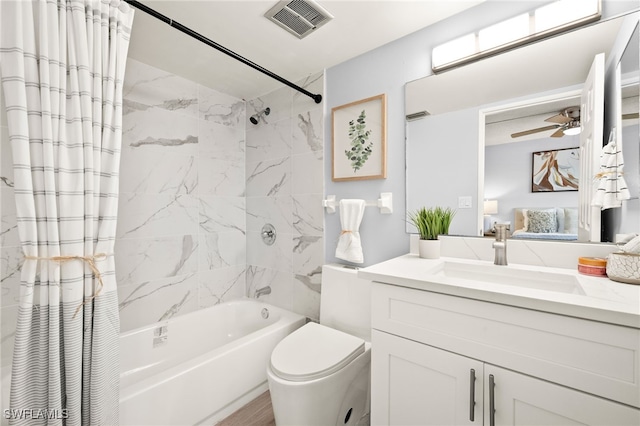 548 Broad Ave S Unit 548, Naples, FL 34102 - ensuite bathroom featuring shower / tub combo with curtain, vanity, toilet, and a ceiling fan