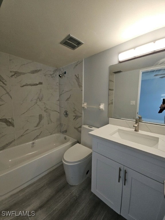 548 Broad Ave S Unit 548, Naples, FL 34102 - bathroom with vanity, shower / washtub combination, toilet, and wood finished floors