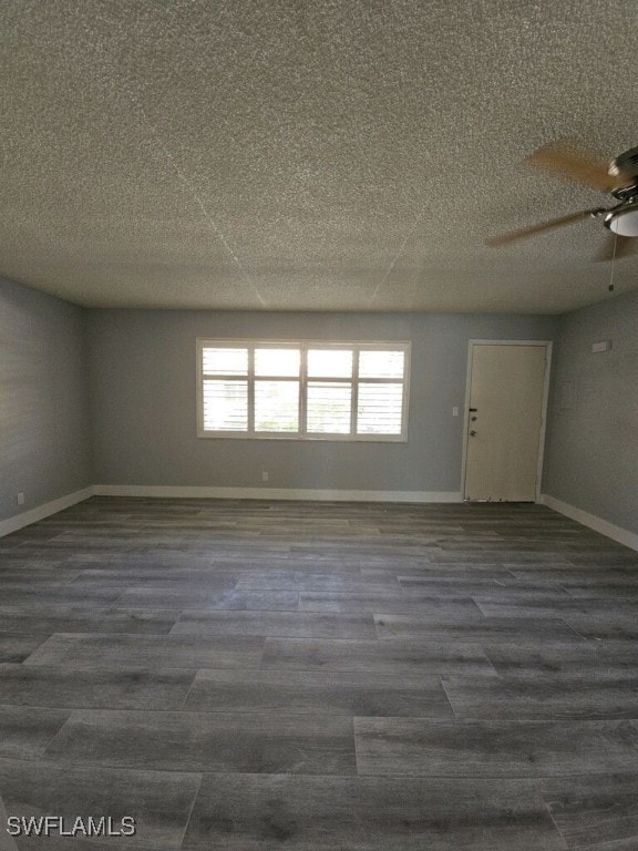 548 Broad Ave S Unit 548, Naples, FL 34102 - spare room with ceiling fan, dark wood-type flooring, a textured ceiling, and baseboards