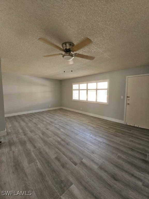 548 Broad Ave S Unit 548, Naples, FL 34102 - unfurnished room featuring a ceiling fan, a textured ceiling, dark wood-type flooring, and baseboards