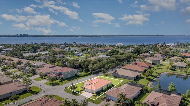 3130 Scarlet Oak Pl, North Fort Myers, FL 33903 - aerial view of residential area featuring a large body of water and property parcel outlined