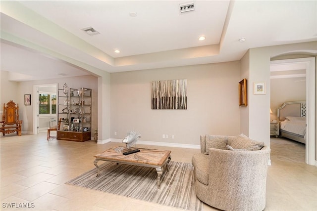 3130 Scarlet Oak Pl, North Fort Myers, FL 33903 - living room featuring arched walkways, a raised ceiling, and recessed lighting