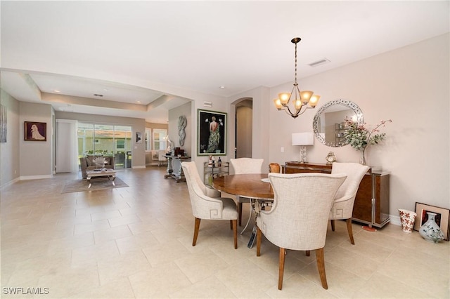3130 Scarlet Oak Pl, North Fort Myers, FL 33903 - dining space featuring arched walkways and a chandelier