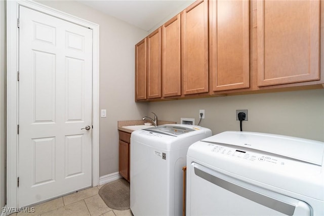 3130 Scarlet Oak Pl, North Fort Myers, FL 33903 - laundry area featuring cabinet space, independent washer and dryer, and light tile patterned floors