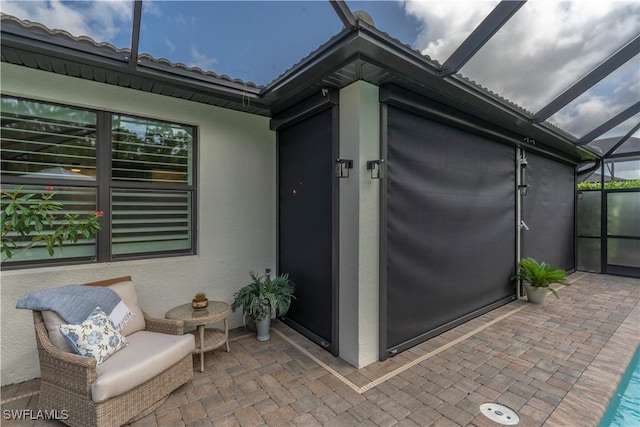 6848 Winding Cypress Dr, Naples, FL 34114 - view of patio / terrace featuring glass enclosure