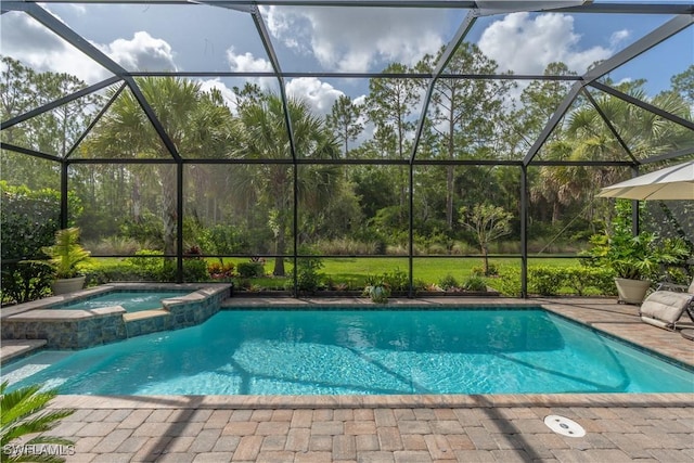 6848 Winding Cypress Dr, Naples, FL 34114 - view of pool featuring glass enclosure, a pool with connected hot tub, and a patio area