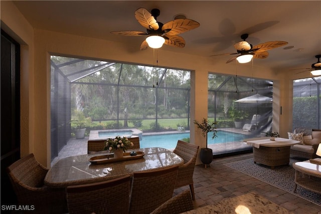 6848 Winding Cypress Dr, Naples, FL 34114 - sunroom with ceiling fan, a jacuzzi, a pool, and outdoor dining space