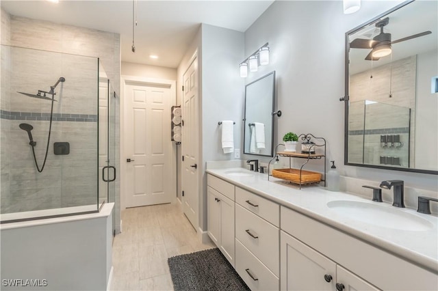 6848 Winding Cypress Dr, Naples, FL 34114 - full bath featuring a stall shower, double vanity, ceiling fan, and recessed lighting