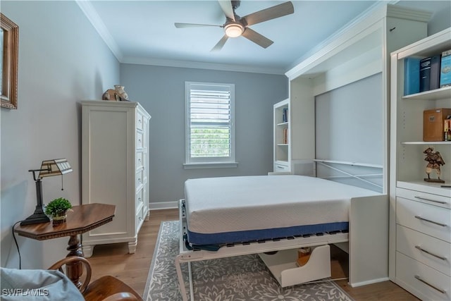 6848 Winding Cypress Dr, Naples, FL 34114 - bedroom with light wood-style floors, crown molding, and ceiling fan