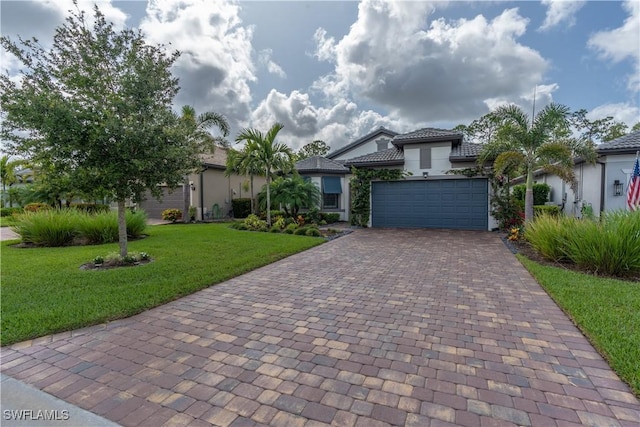 6848 Winding Cypress Dr, Naples, FL 34114 - mediterranean / spanish house featuring decorative driveway, stucco siding, a front yard, and an attached garage
