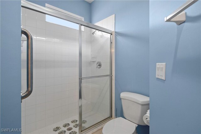 25057 Peacock Ln Unit 202, Naples, FL 34114 - full bathroom featuring toilet and a stall shower