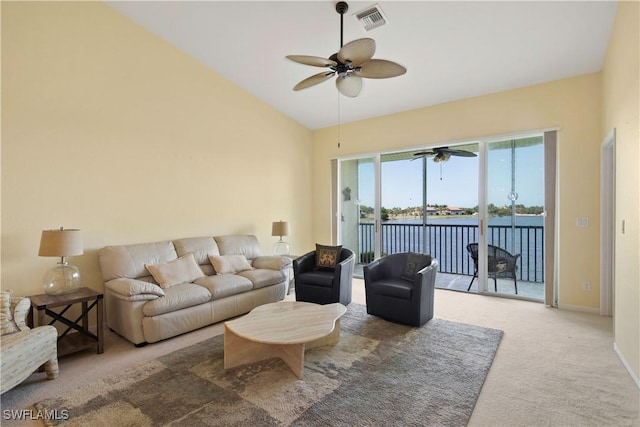 25057 Peacock Ln Unit 202, Naples, FL 34114 - carpeted living area featuring a ceiling fan, lofted ceiling, and baseboards