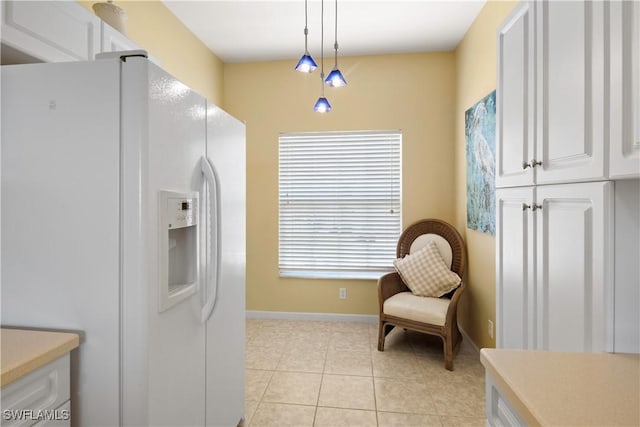 25057 Peacock Ln Unit 202, Naples, FL 34114 - sitting room featuring light tile patterned floors and baseboards