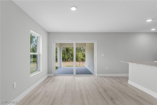 365 Woodburn Dr, Lehigh Acres, FL 33972 - unfurnished room featuring light wood-style floors, baseboards, and recessed lighting
