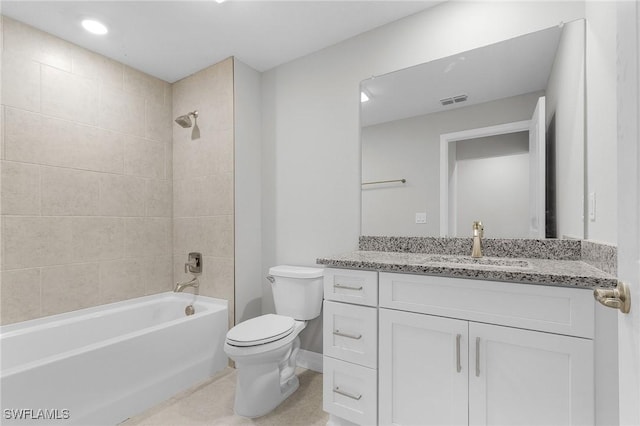 365 Woodburn Dr, Lehigh Acres, FL 33972 - bathroom featuring toilet, vanity, and bathtub / shower combination