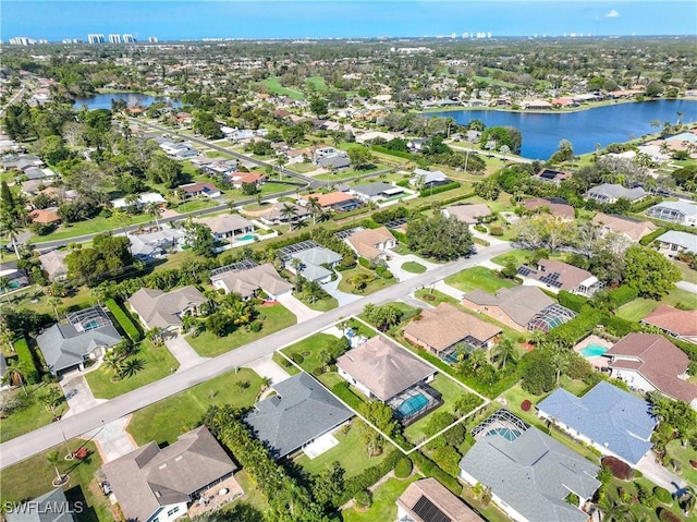 520 Raven Way, Naples, FL 34110 - aerial overview of property's location with a large body of water and nearby suburban area