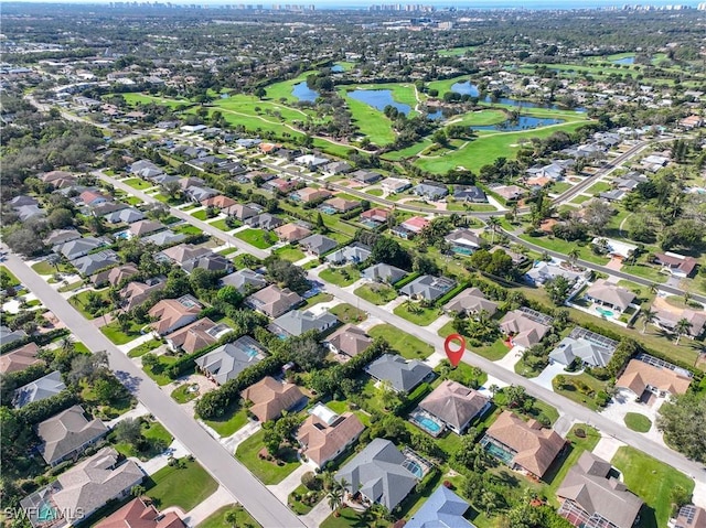 520 Raven Way, Naples, FL 34110 - aerial view of property and surrounding area featuring a nearby body of water, nearby suburban area, and a golf course
