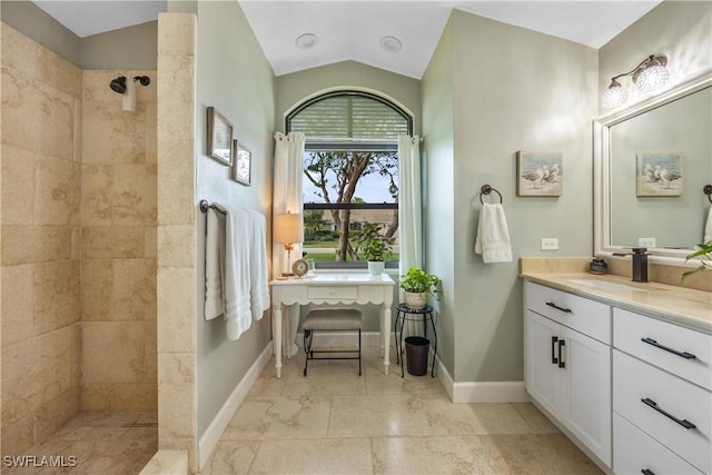520 Raven Way, Naples, FL 34110 - bathroom with a walk in shower, vanity, lofted ceiling, and baseboards