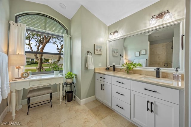 520 Raven Way, Naples, FL 34110 - full bathroom with double vanity, a stall shower, and baseboards
