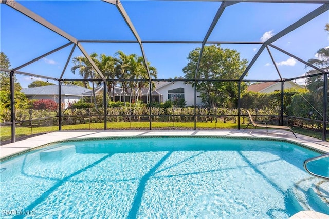 520 Raven Way, Naples, FL 34110 - swimming pool featuring glass enclosure and a patio