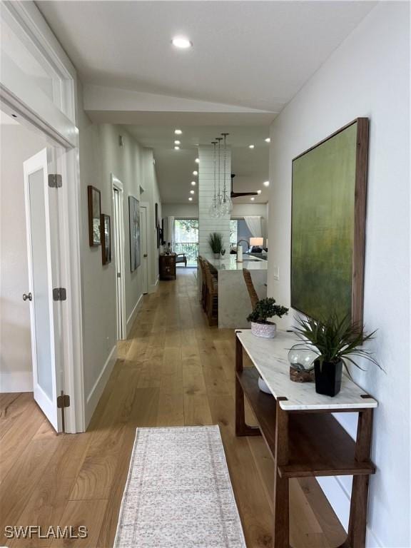 7087 Barrington Cir Unit 201, Naples, FL 34108 - corridor featuring wood finished floors, recessed lighting, and baseboards