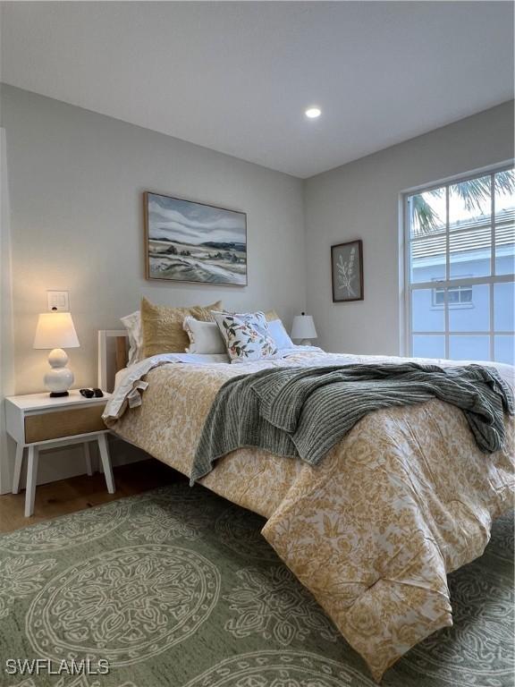 7087 Barrington Cir Unit 201, Naples, FL 34108 - bedroom with wood finished floors and recessed lighting