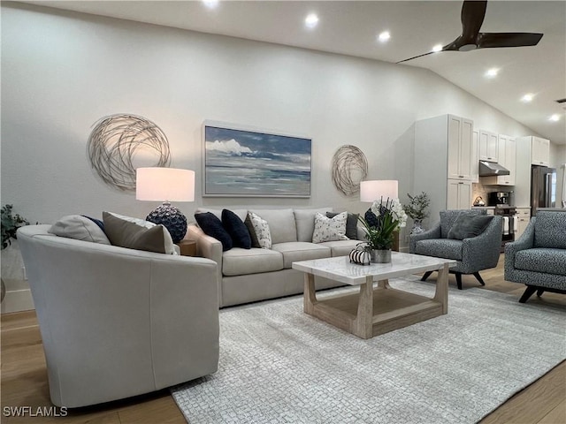 7087 Barrington Cir Unit 201, Naples, FL 34108 - living area with ceiling fan, light wood-style flooring, lofted ceiling, and recessed lighting
