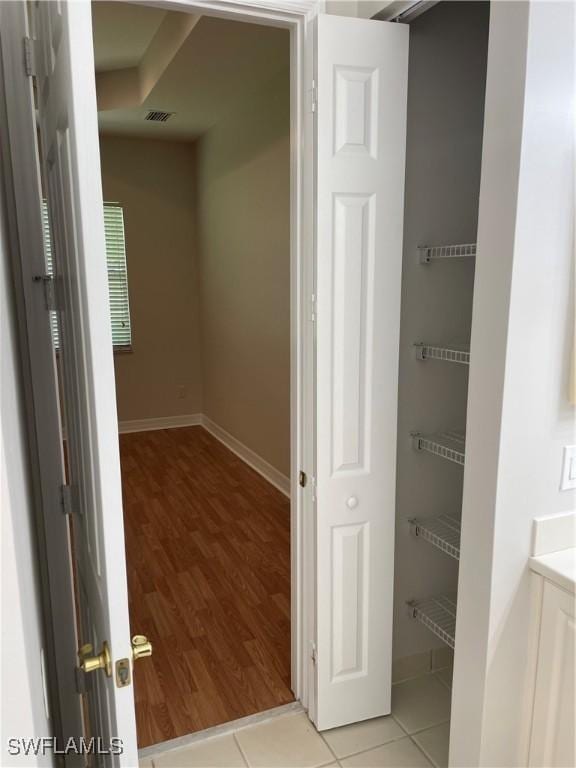 10427 Carolina Willow Dr, Fort Myers, FL 33913 - hallway featuring baseboards and light wood finished floors