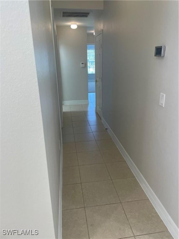 10427 Carolina Willow Dr, Fort Myers, FL 33913 - corridor with light tile patterned flooring and baseboards