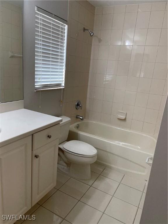 10427 Carolina Willow Dr, Fort Myers, FL 33913 - bathroom featuring tile patterned flooring, toilet,  shower combination, and vanity