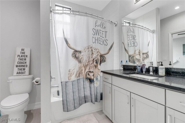 7501 Carnegie Way, Naples, FL 34119 - full bathroom featuring vanity, toilet, and shower / bath combination with curtain