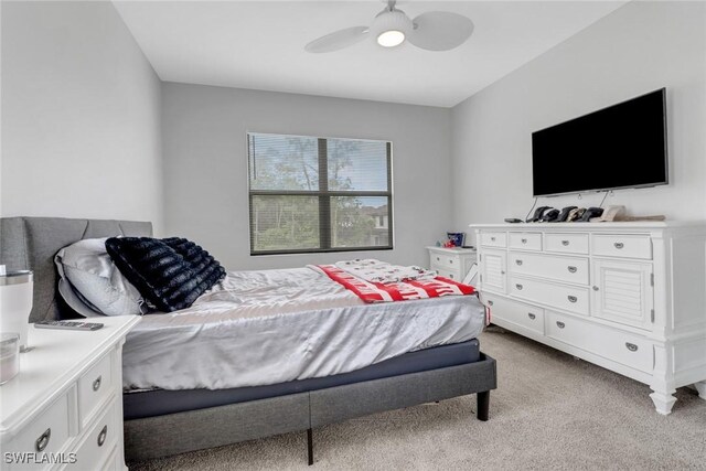7501 Carnegie Way, Naples, FL 34119 - bedroom featuring light carpet and ceiling fan