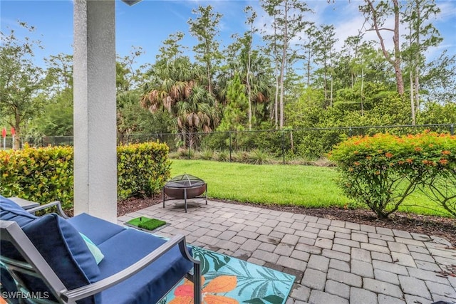 7501 Carnegie Way, Naples, FL 34119 - view of patio / terrace with an outdoor living space with a fire pit