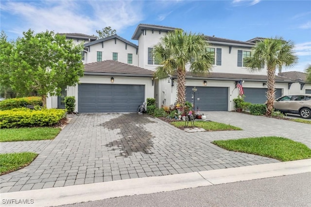 7501 Carnegie Way, Naples, FL 34119 - view of front of home featuring decorative driveway, stucco siding, and a tile roof