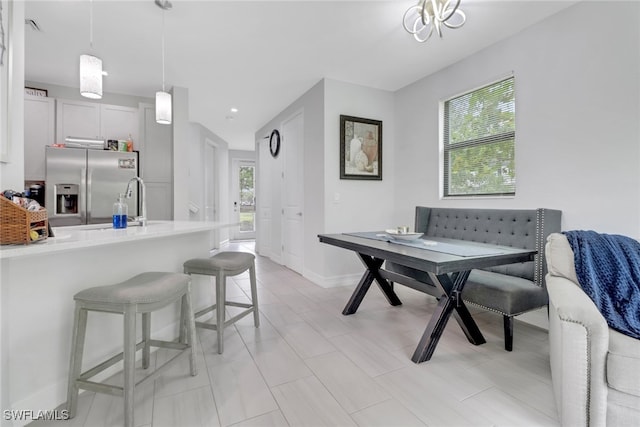 7501 Carnegie Way, Naples, FL 34119 - dining space with baseboards