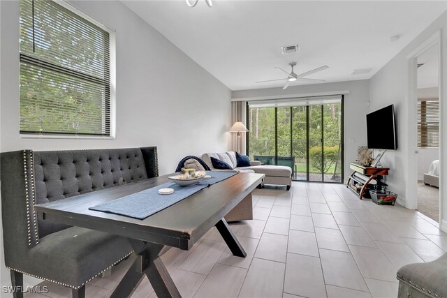 7501 Carnegie Way, Naples, FL 34119 - living room featuring a ceiling fan and tile patterned floors