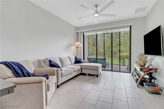7501 Carnegie Way, Naples, FL 34119 - living room featuring a ceiling fan and light tile patterned floors