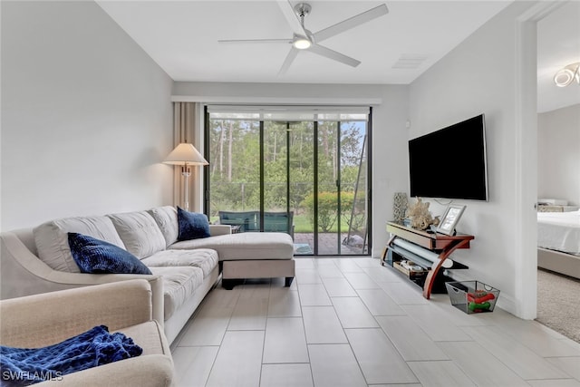 7501 Carnegie Way, Naples, FL 34119 - living area featuring a ceiling fan