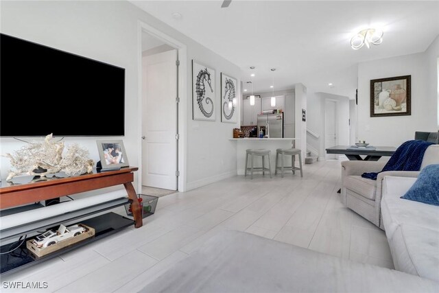 7501 Carnegie Way, Naples, FL 34119 - living room with stairs and recessed lighting