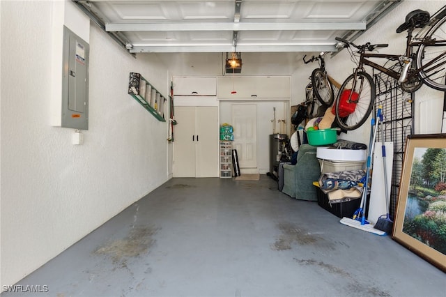 15873 Marcello Cir Unit 76, Naples, FL 34110 - garage featuring electric panel and a textured wall