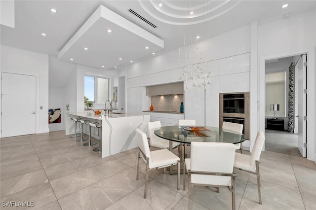 432 Bayside Ave, Naples, FL 34108 - dining area featuring recessed lighting, light tile patterned floors, and a high ceiling