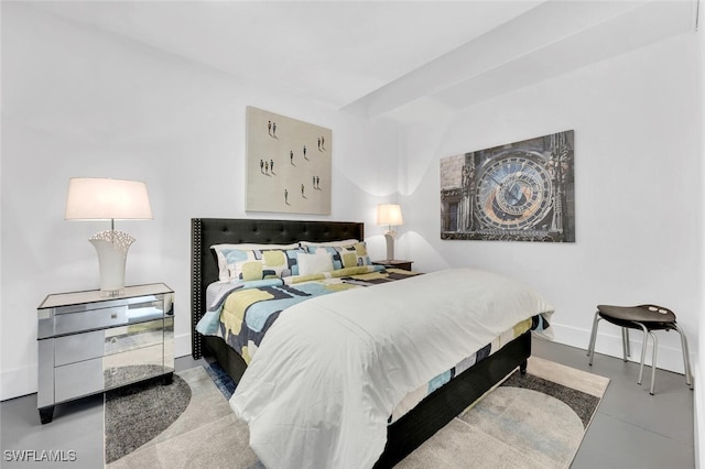 432 Bayside Ave, Naples, FL 34108 - bedroom with baseboards and finished concrete flooring
