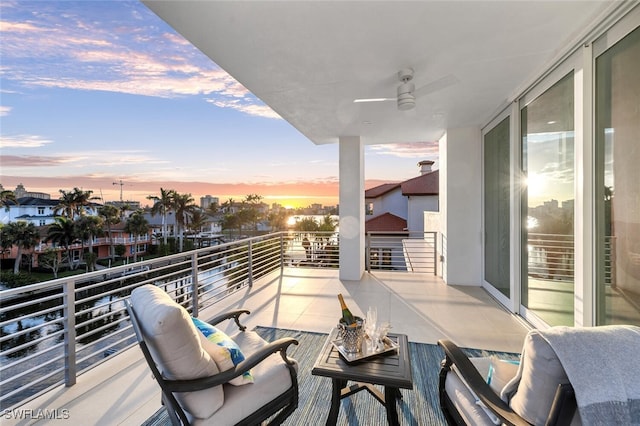 432 Bayside Ave, Naples, FL 34108 - balcony at dusk with a ceiling fan